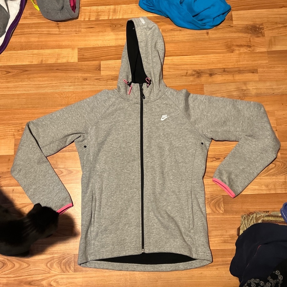 nike grey zip up jacket with pink accents. women’s, size medium but says large.